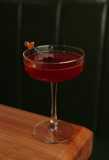 Red cocktail served in a coupe glass at Ray’s Restaurant.