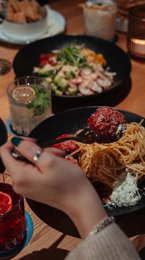 Spaghetti topped with a meatball and grated cheese at Ray’s Restaurant.