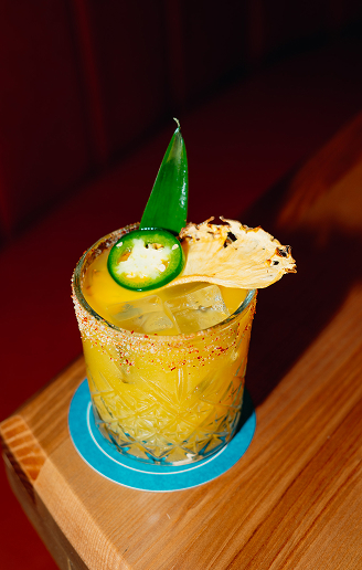 Pineapple cocktail garnished with jalapeño and pineapple at Ray’s Restaurant.