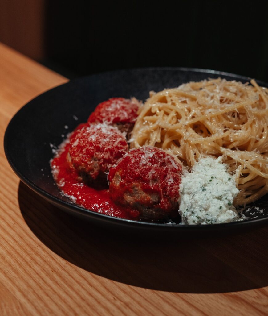 Ray’s Truffle Spaghetti and Meatballs served with pasta, tomato sauce, ricotta, and parmesan.
